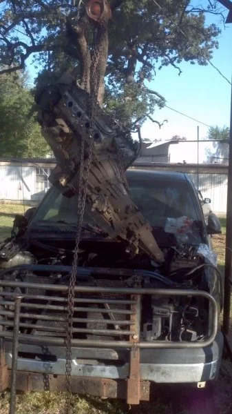 Pulling the old engine and transmission out.
