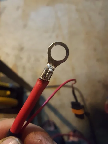 Soldered ring-terminal on 12-ga wire.