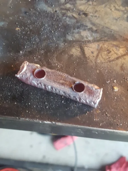 Two pieces welded together.