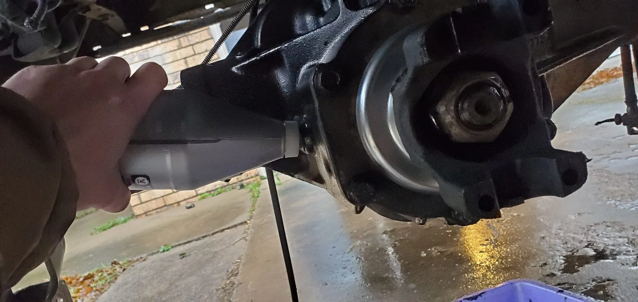 Filling rear end with gear oil.