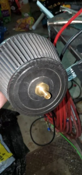 Outside of the air filter.