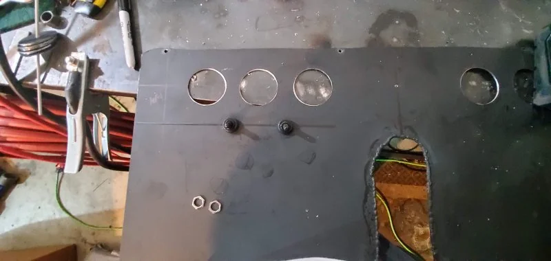 Holes cut for toggle switches.