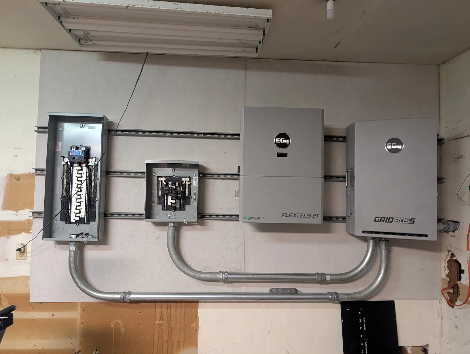 View of all three lower conduit runs in place, looking much cleaner
