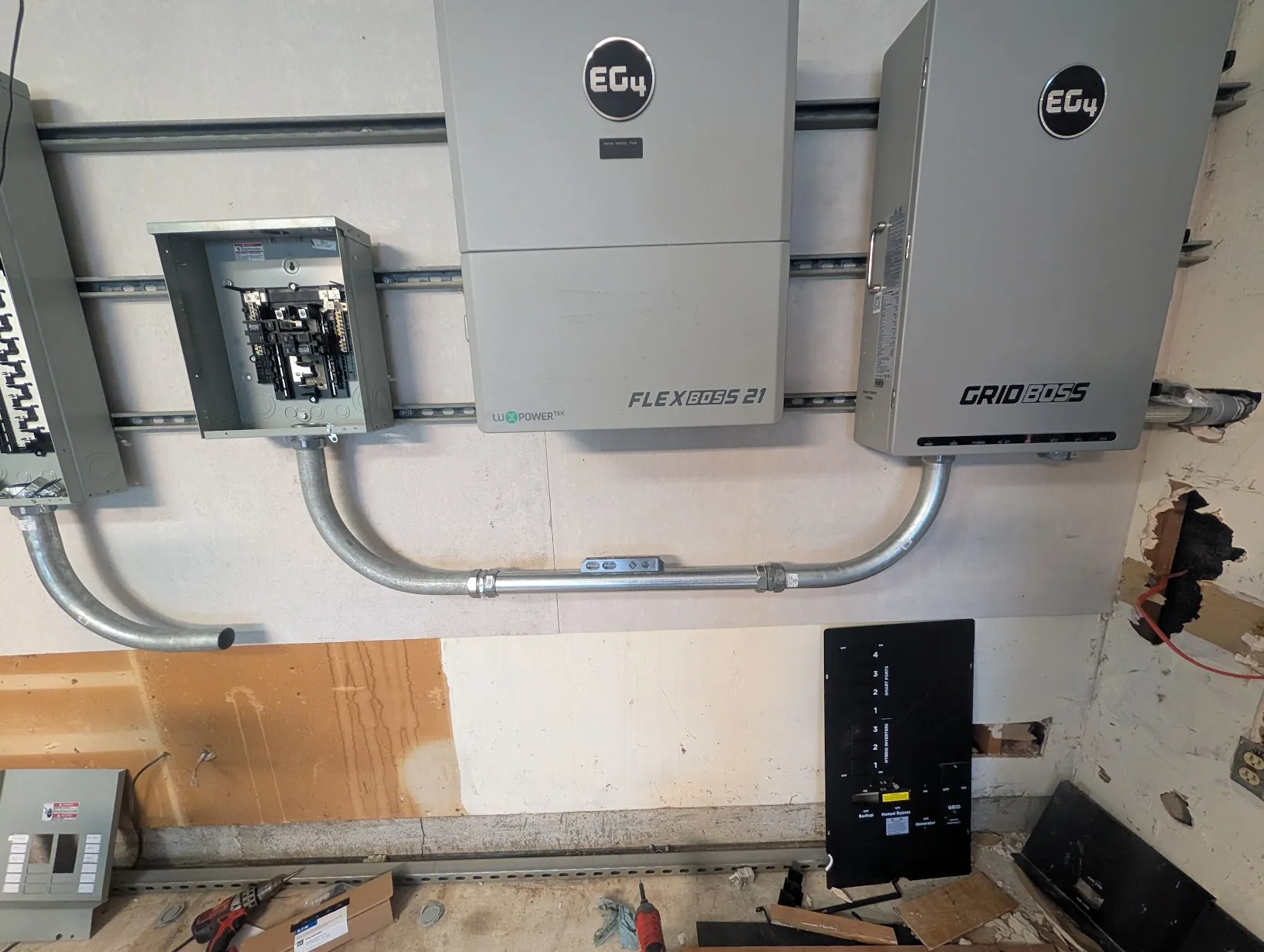 Conduit run between the main panel and GridBoss installed and squared up