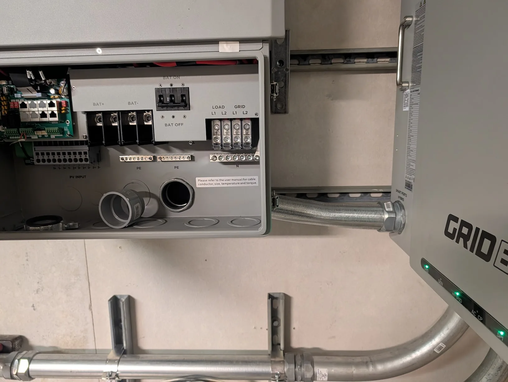 Finished EMT run between the GridBoss and FlexBoss with compression connectors installed