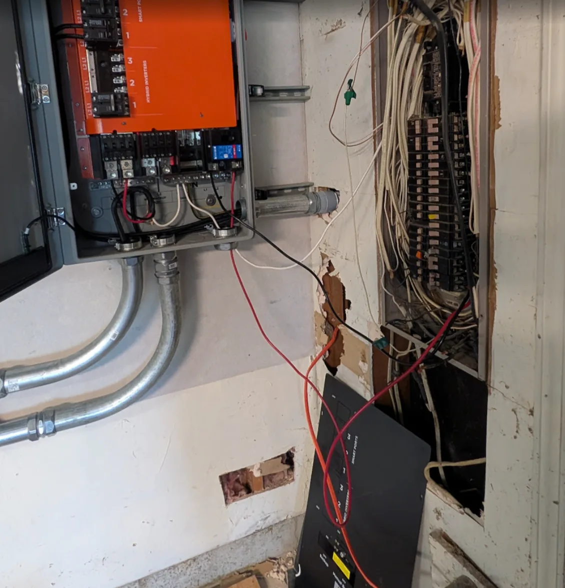 Wider view of the GridBoss with the temporary feeder run over to the existing house panel