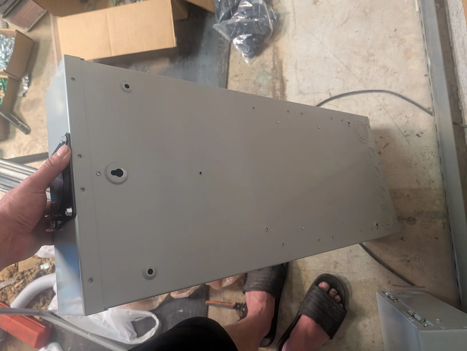 Back of the 200A main panel showing the factory mounting holes