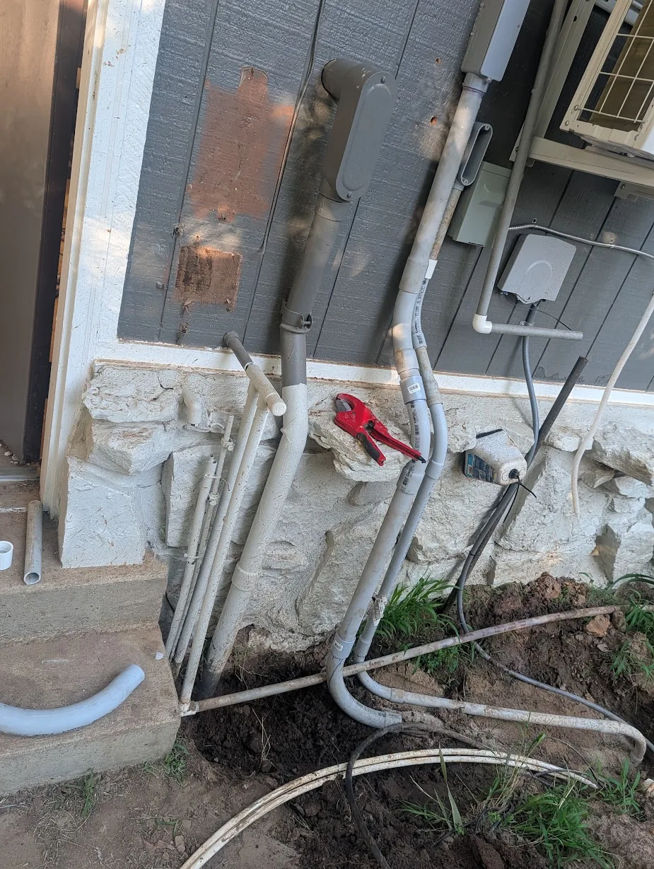 1" PV conduit added to the right of the existing 1.5" shop feeder conduit