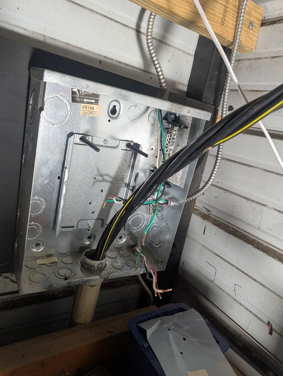 Shed subpanel with all the branch circuits disconnected and pulled to the side