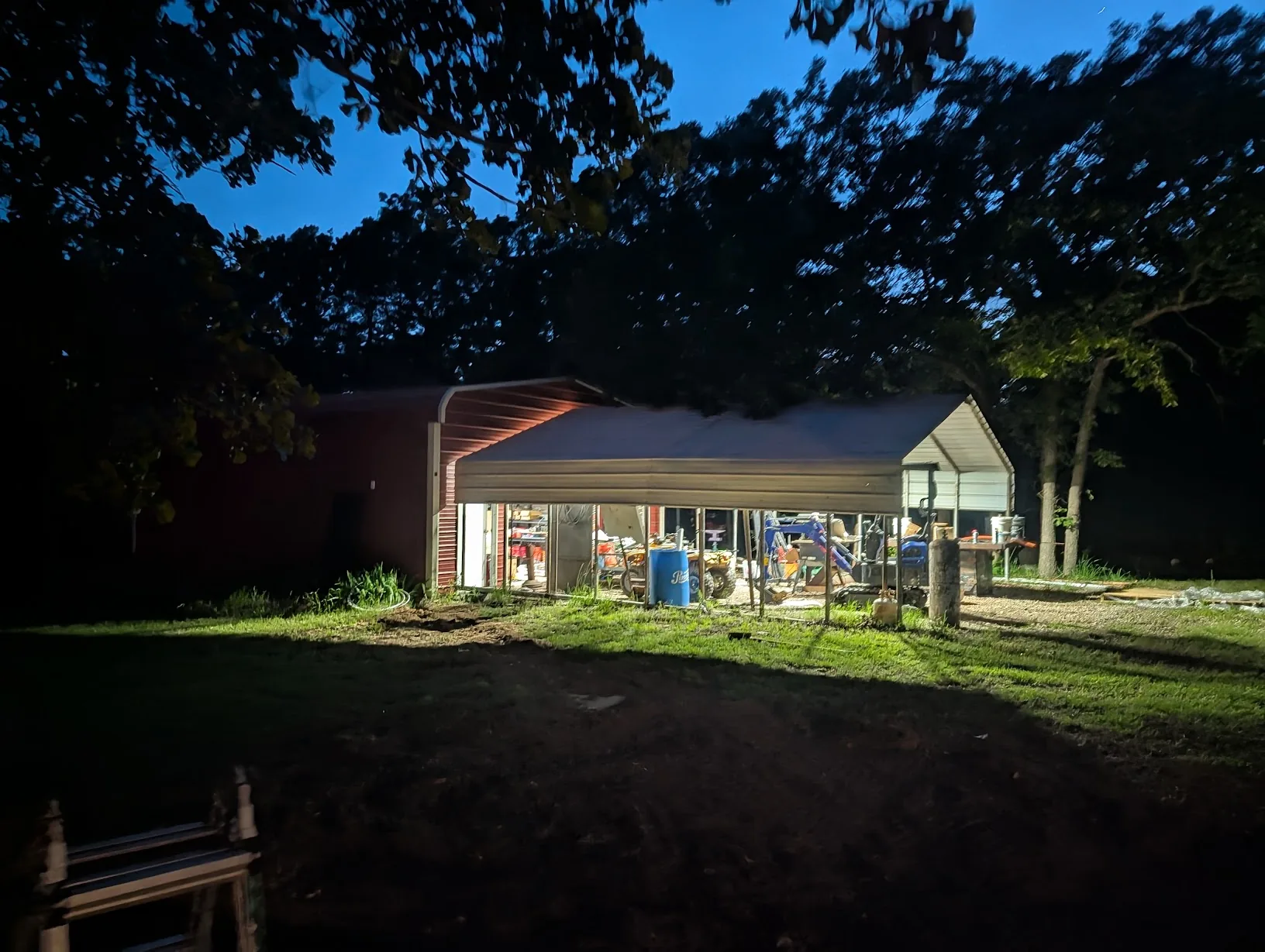 Nighttime shot of the shop with all the lights on — power restored