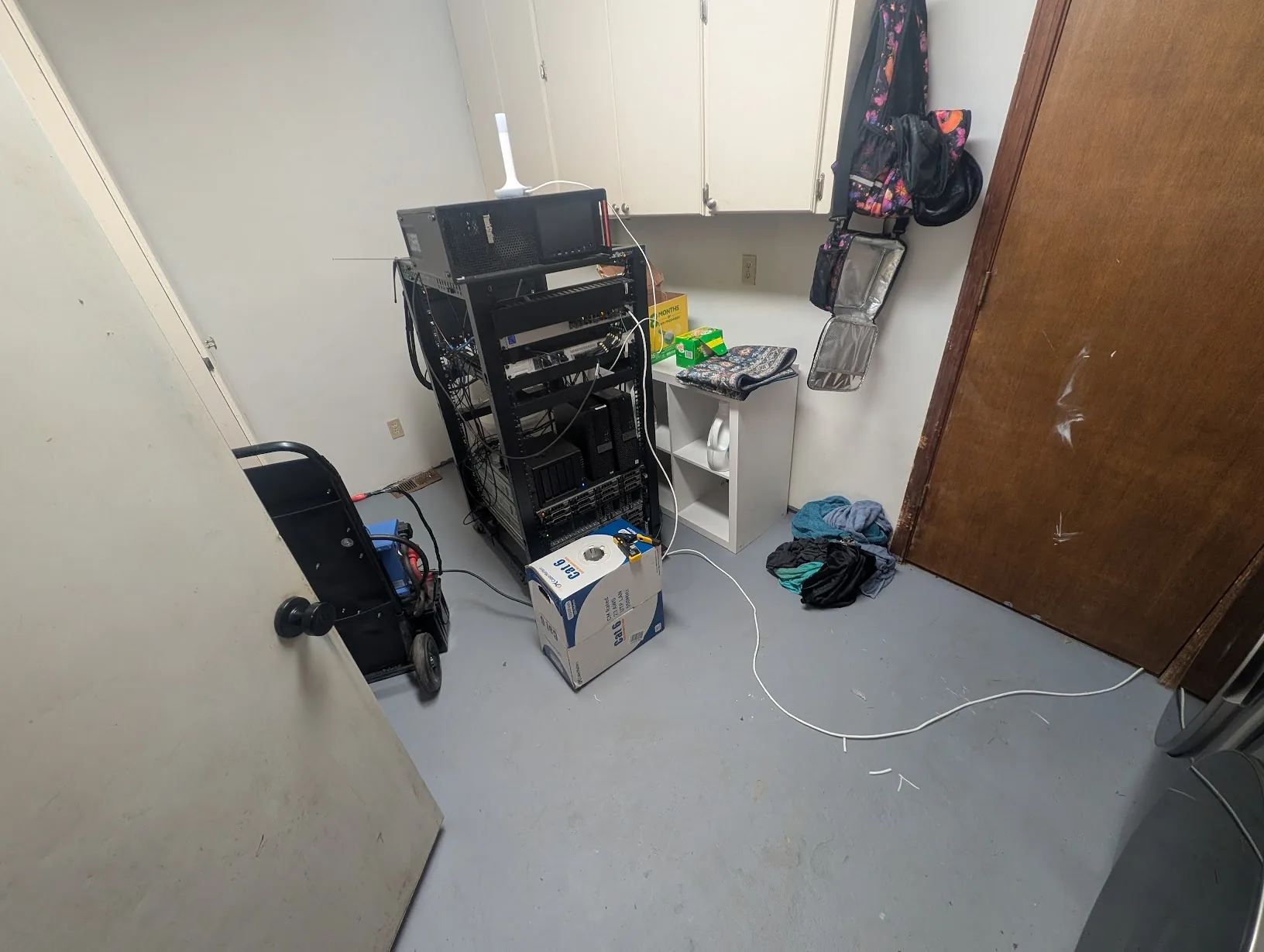 Server rack parked in the laundry room as a temporary home