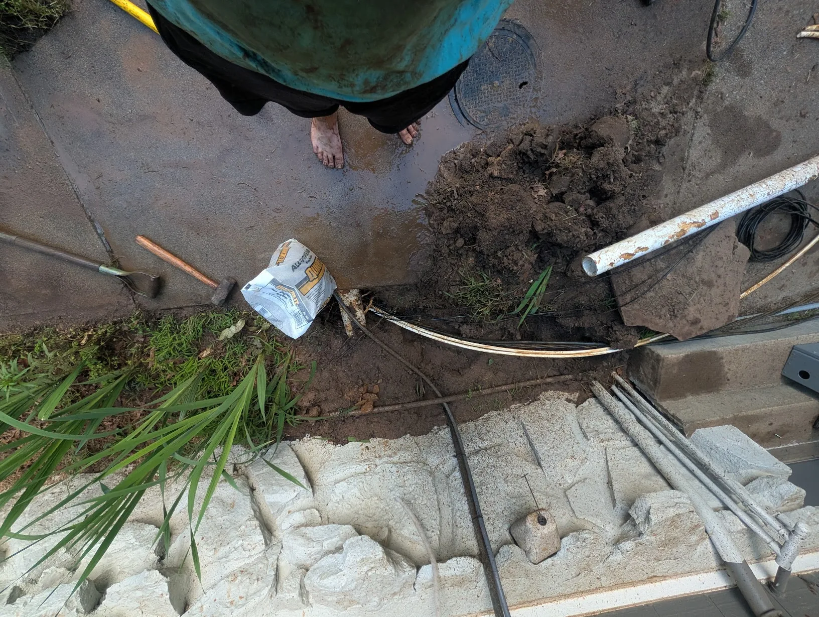 Cable and conduit pulled under the sidewalk past the existing PVC