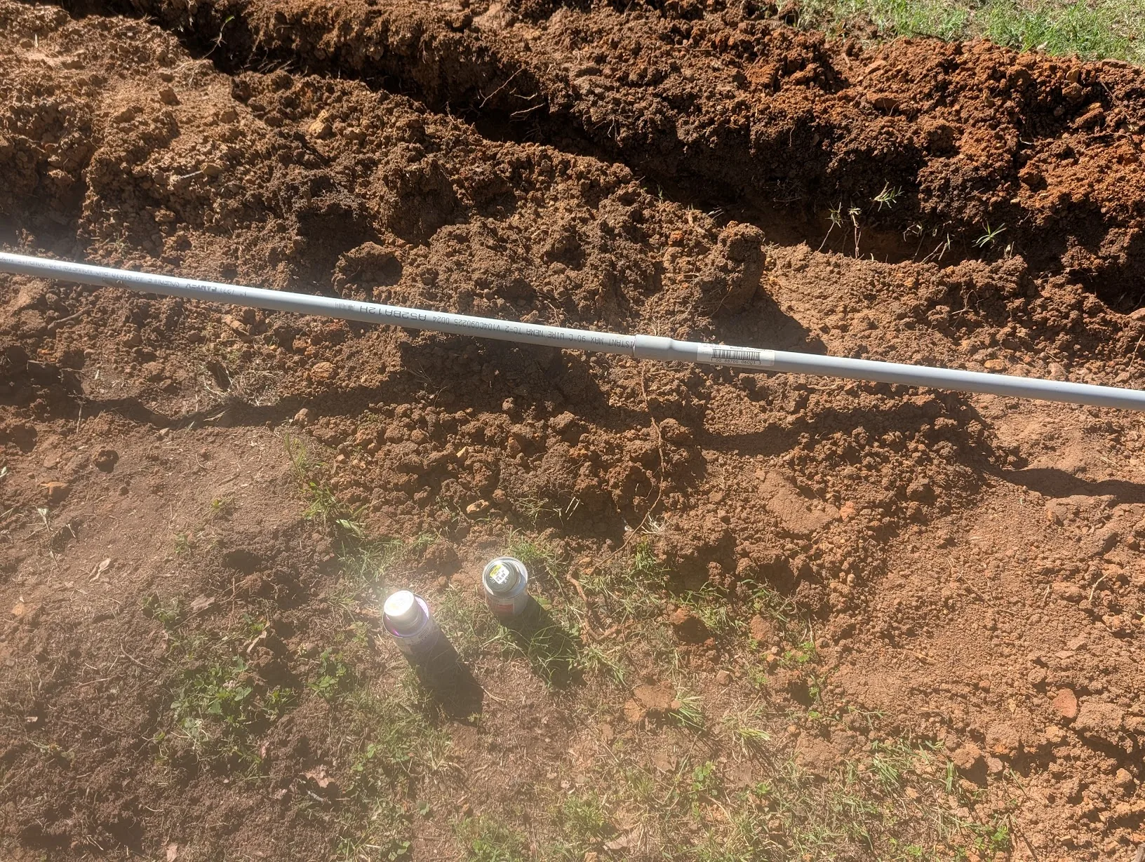 Conduit laid out and glued along the trench