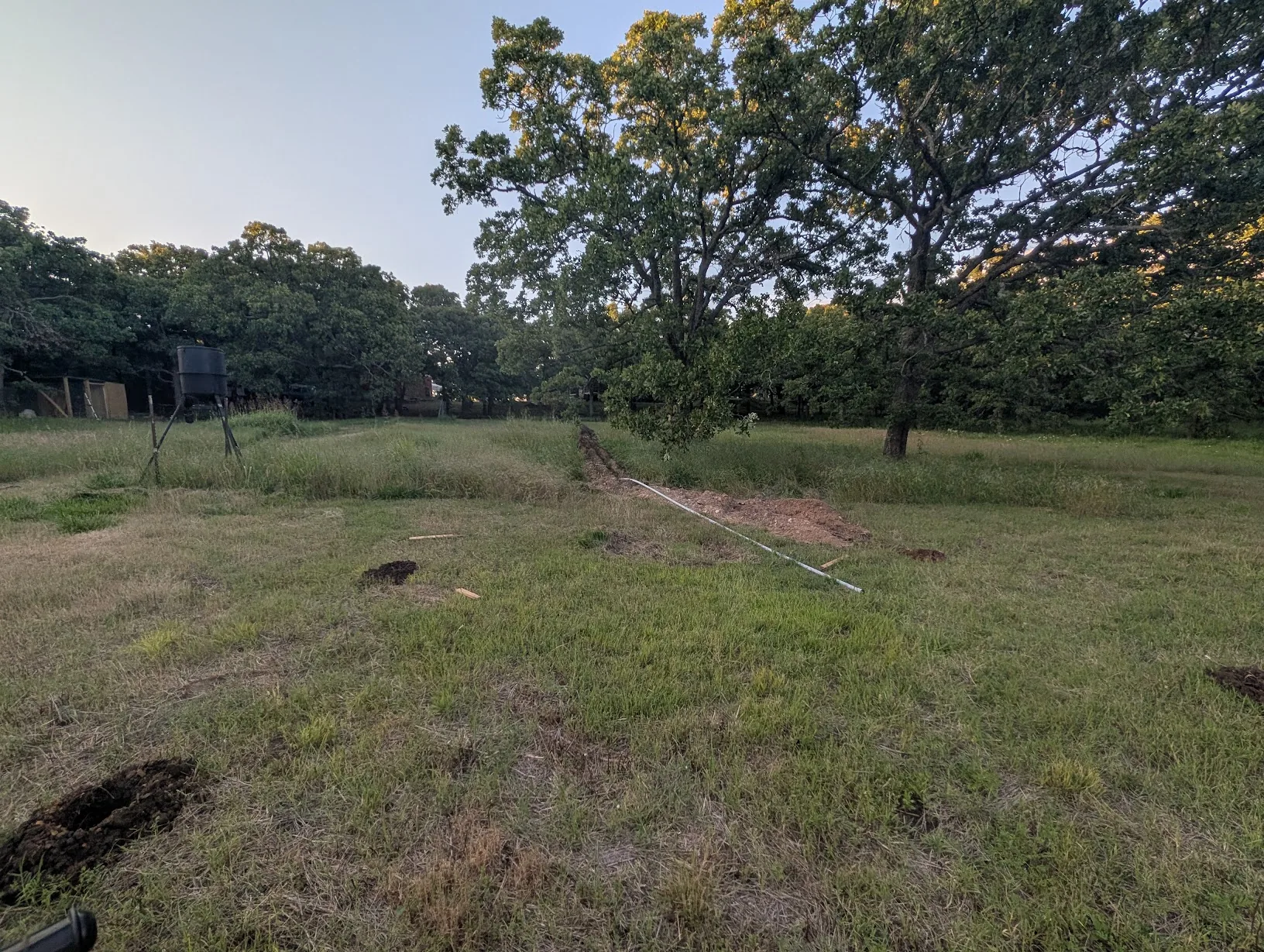 300ft of 1" conduit run with the end capped, four post holes visible