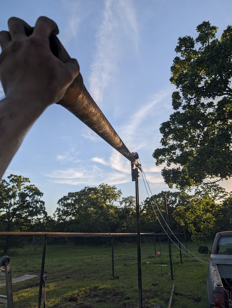 Drill tube hanging under control from the chain hoist