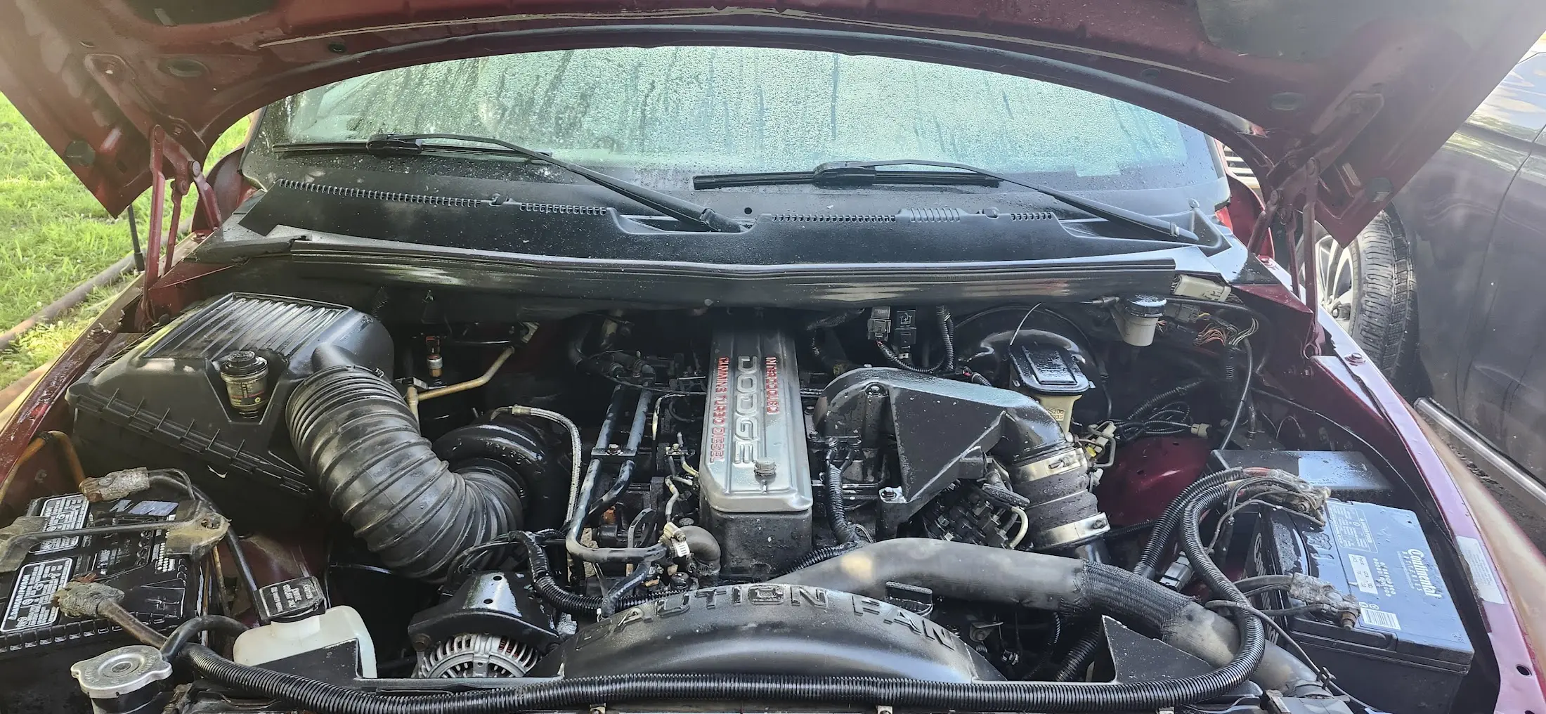Image showing the engine bay after being pressure washed, still wet