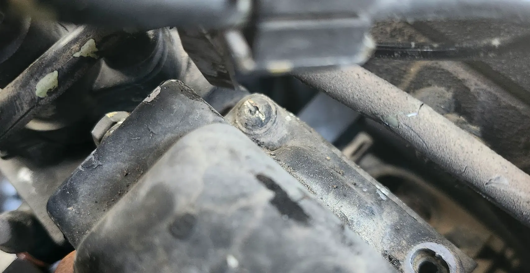 Image showing the security screw on the AFC, with a slot chiseled into it