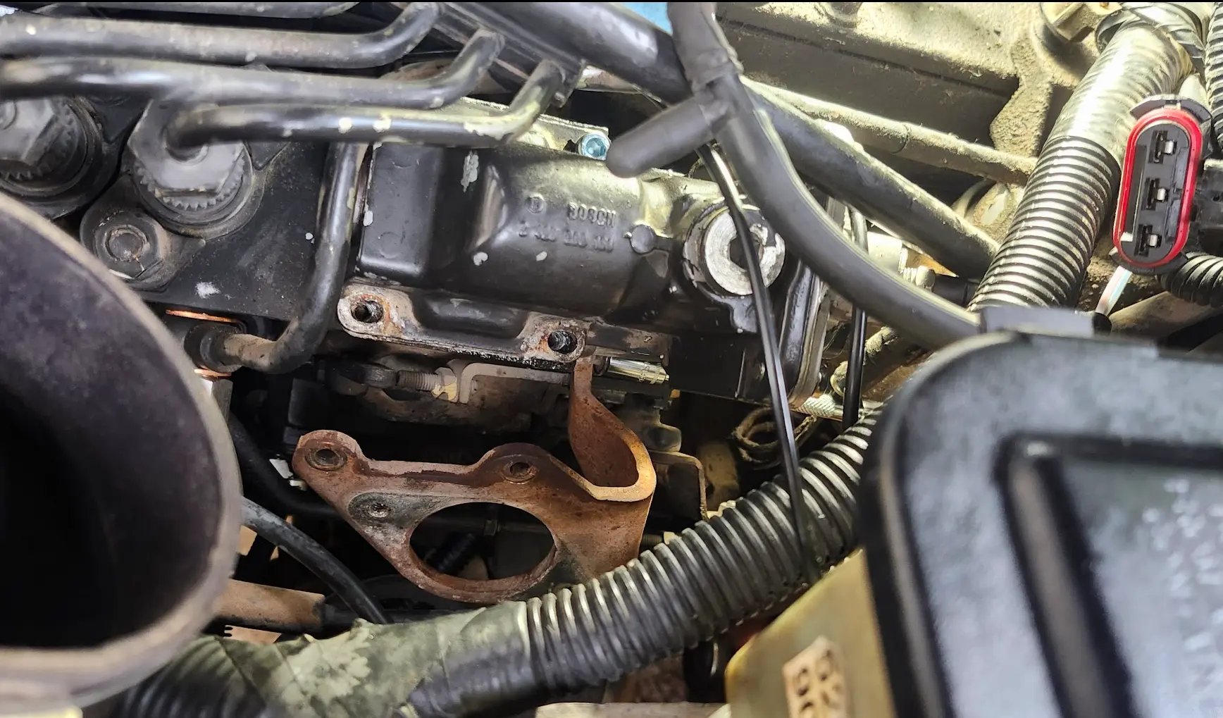 Picture showing the Pump, with AFC on top, and the fuel shutoff solenoid bracket removed.