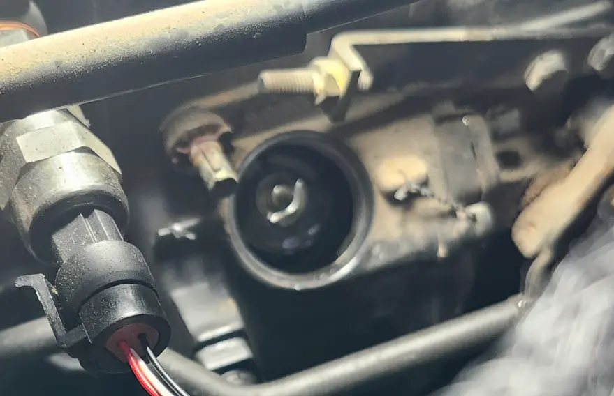 Showing access port, with governor spring centered ready to come out.