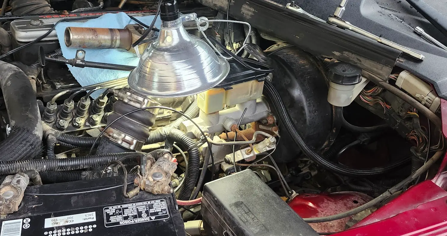 A random image showing a clamp light sitting above the pump, to help provide light in the tiny confined spaces
