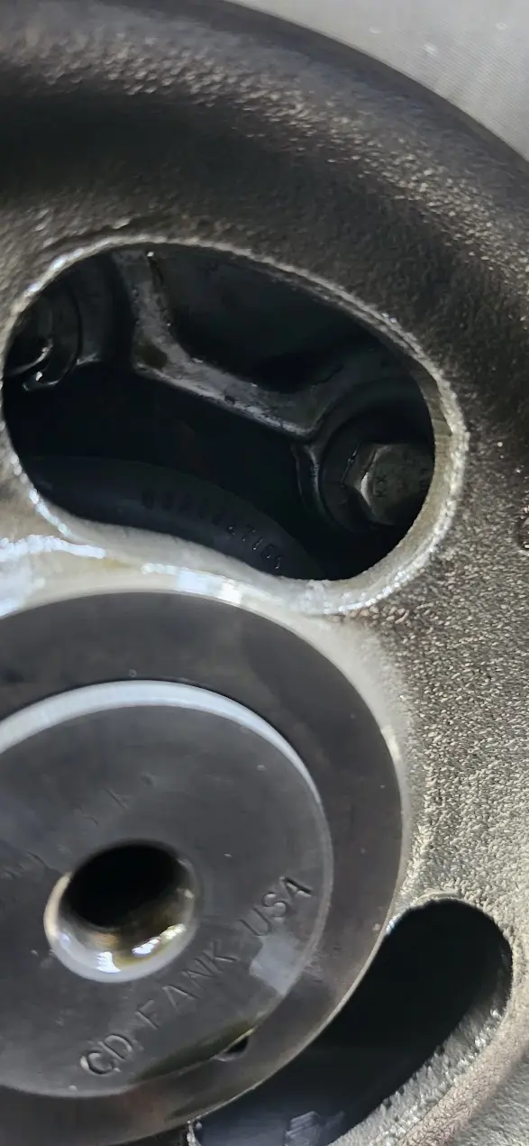 Picture showing bolts hiding behind a gear.