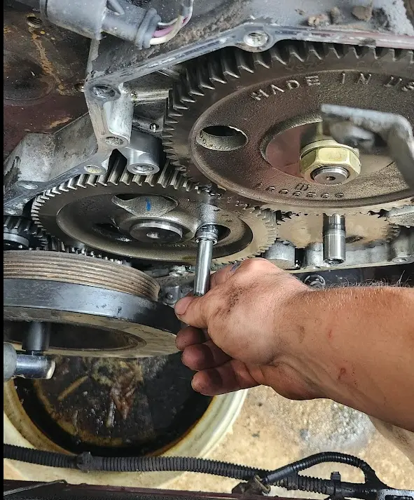 Picture showing my ratchet going behind one of the gears to reach the bolt.