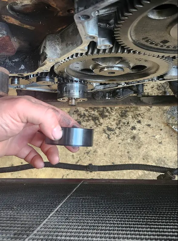 Holding the timing sleeve in front of the crankshaft