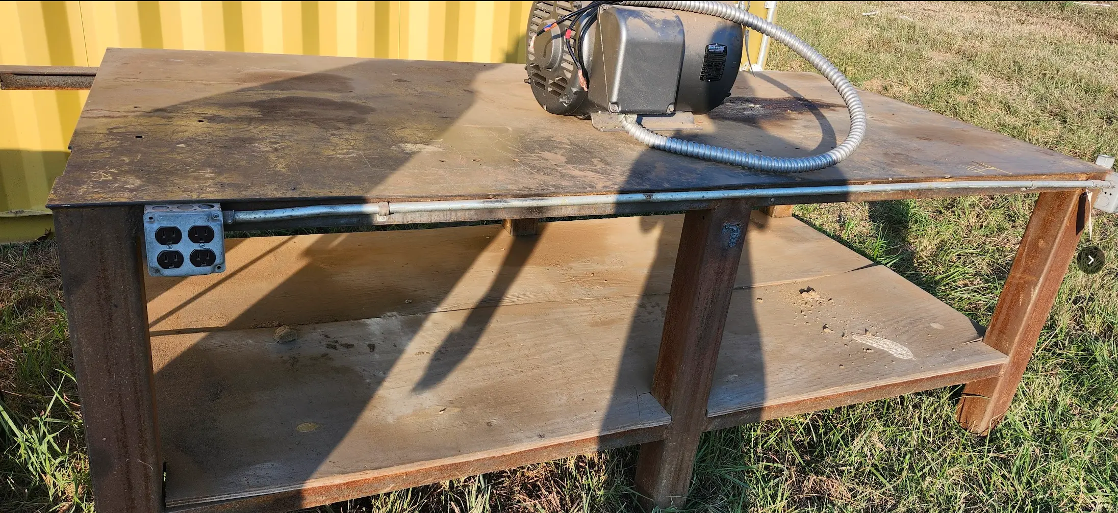 Sturdy steel table being auctioned