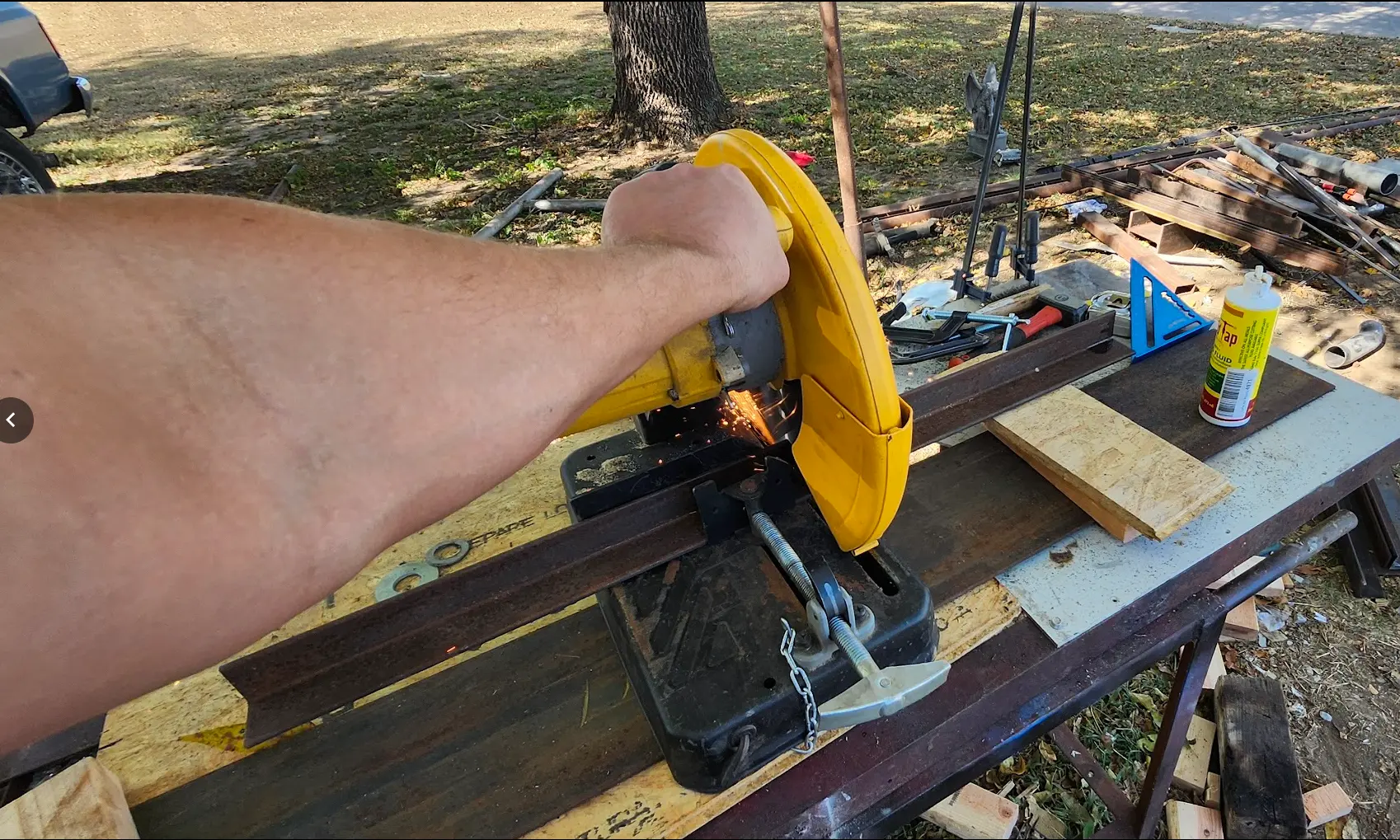 Photo showing angle-iron being cut with dewalt chop-saw