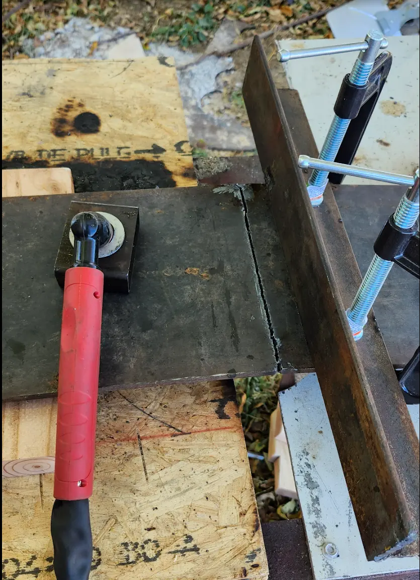 Image showing a line cut into the plate using the homemade torch guide