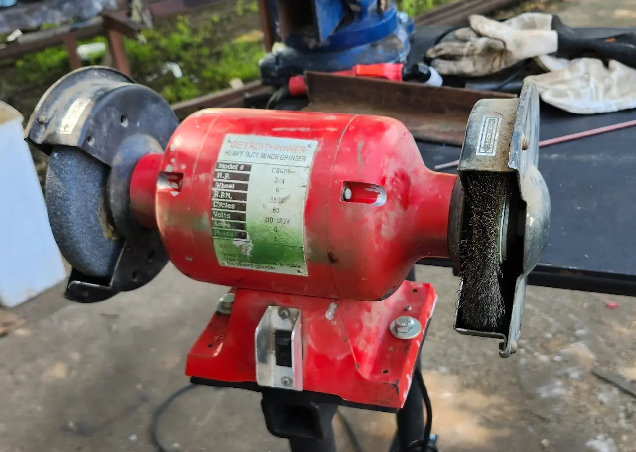 Photo showing the bench grinder successfully mounted.