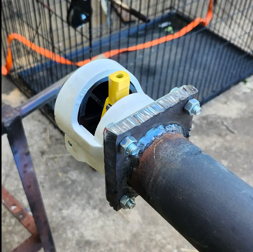 Picture showing the pad welded to the table's leg, and the caster mounted