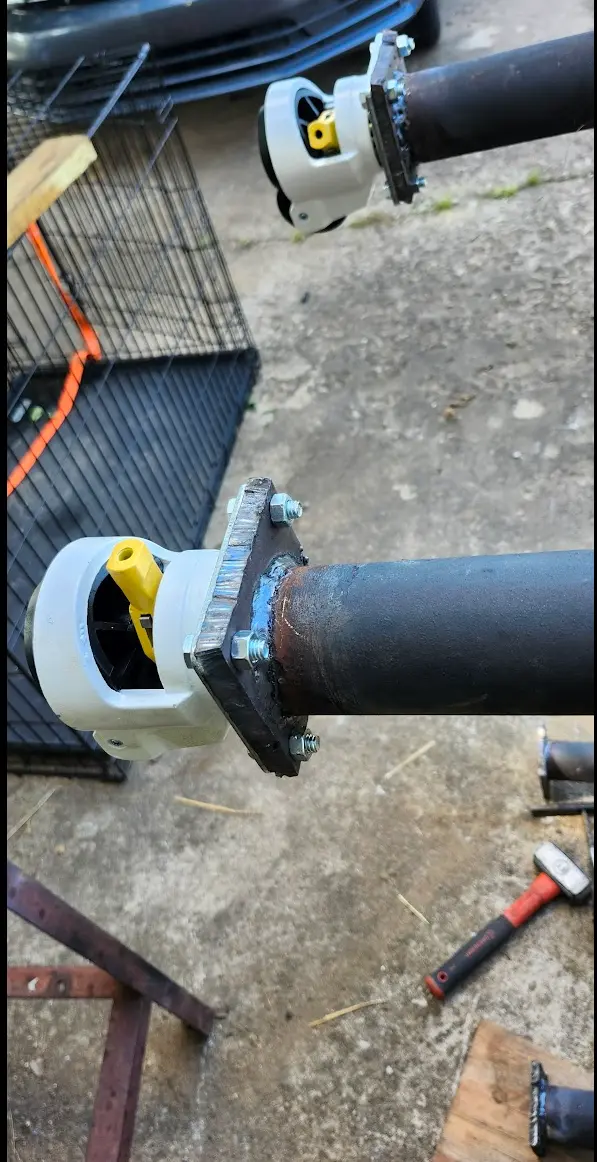 In this photo, all four pads are welded on, with two of the casters mounted