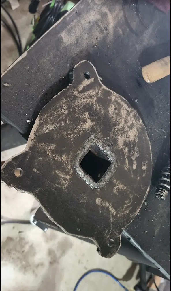 Photo showing the plate mounted to the tube, installed in the vertical post.