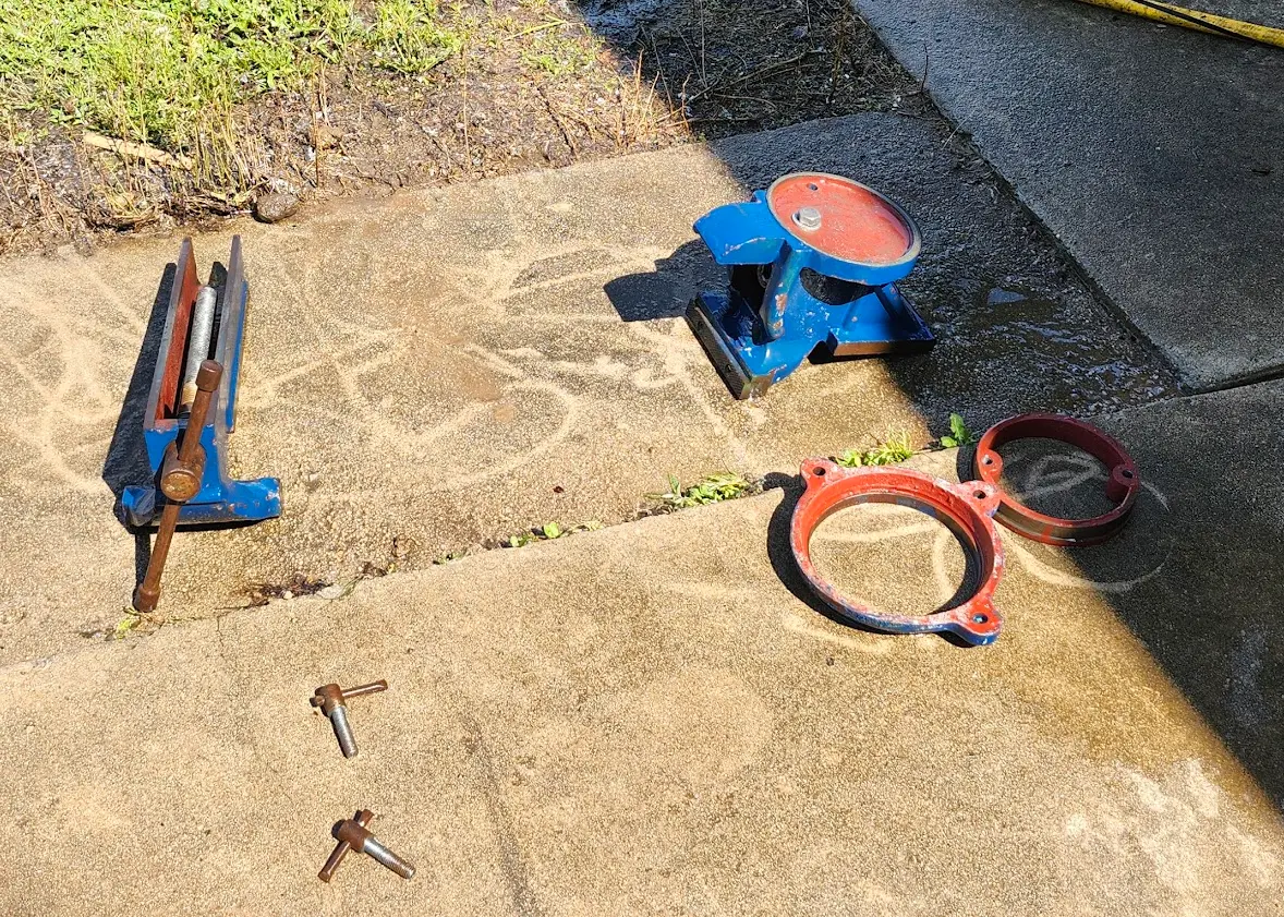 Photo showing vise completely disassembled, and cleaned