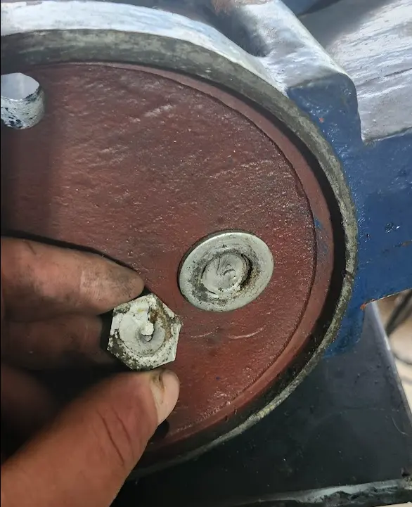 Photo showing the broken bolt used to hold the vise nut.