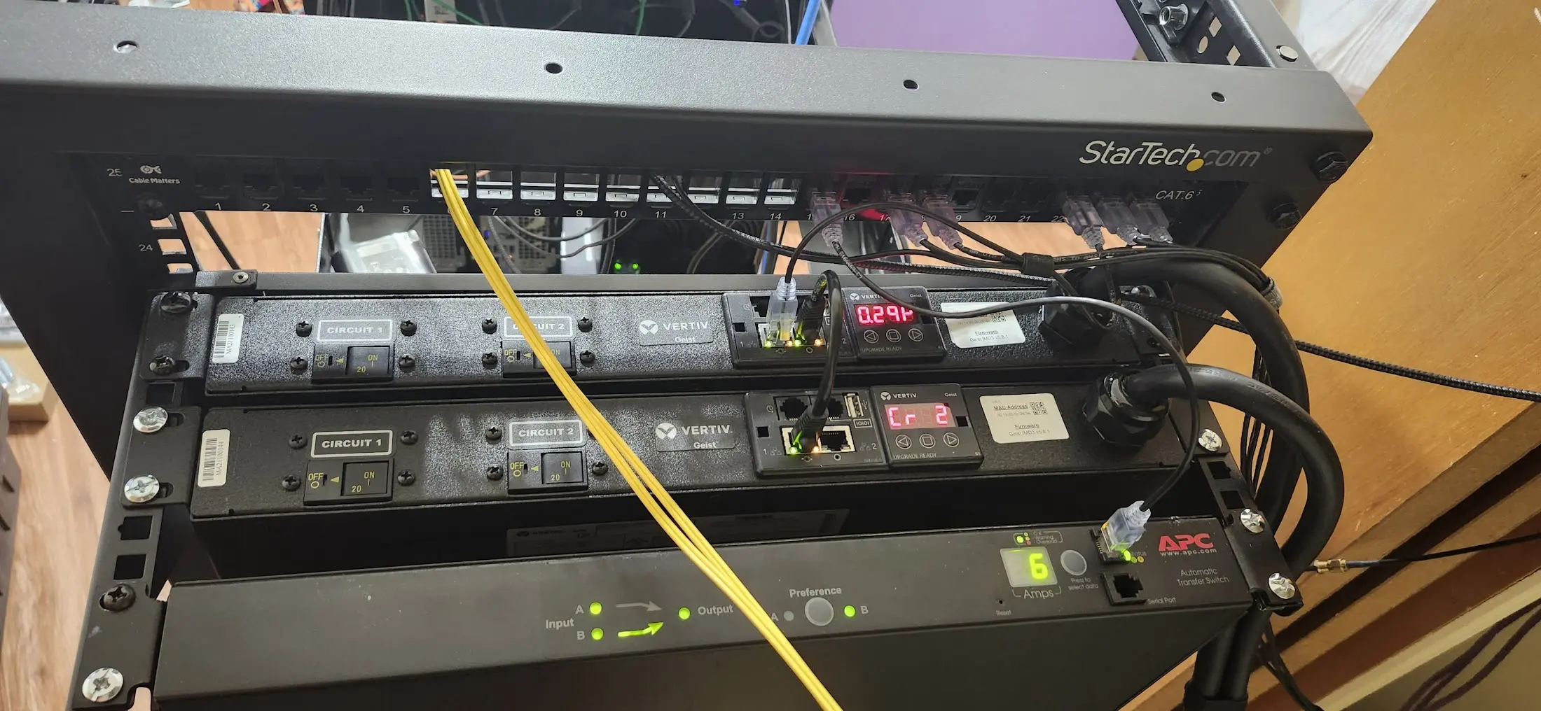 Picture of the top, rear of my rack. Two PDUs, and a ATS visible