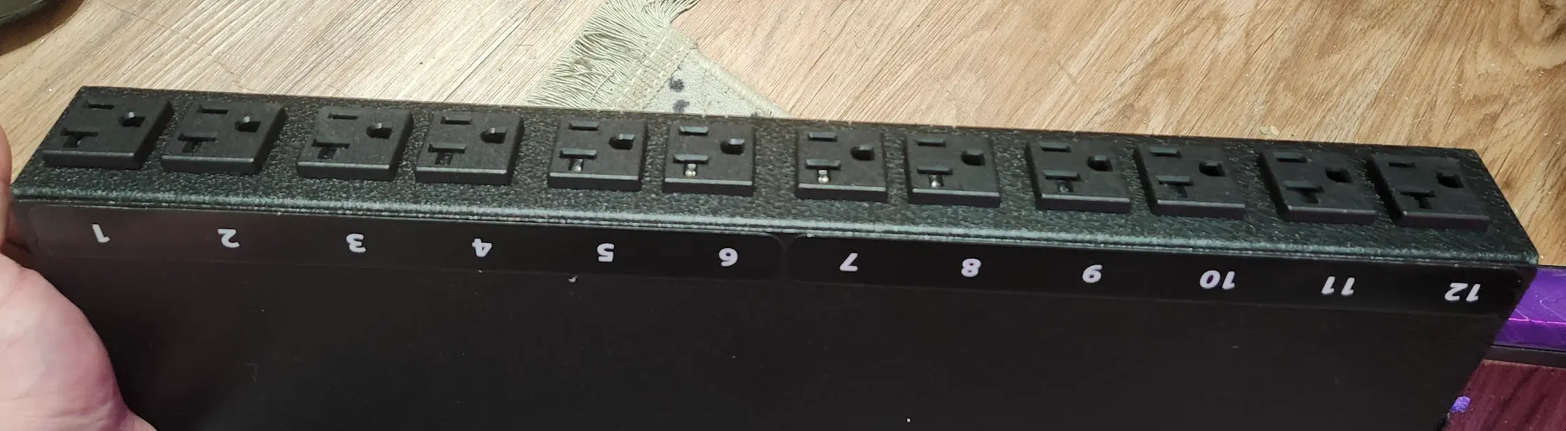 Picture of the rear, showing 12 outlets.